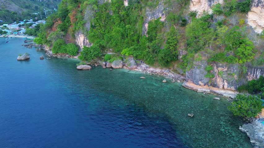 Aerial View of a Coastal Village and Tropical Bay