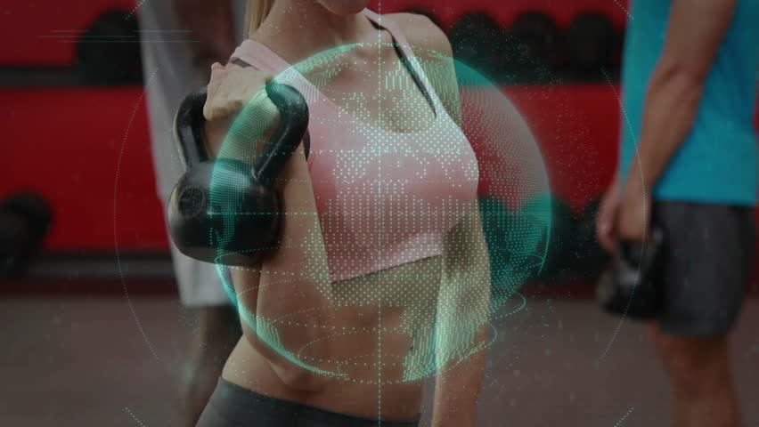 Holding kettlebell on shoulder, woman in pink sports top giving thumbs-up at gym, digital overlay. Weight, fitness, gym, holographic, globe, mesh, lifting