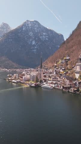 Vertical view of the lake and mountains in the picturesque village of Hallstatt, Austria.