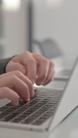 Male Hands Typing on Laptop Keyboard, vertical video