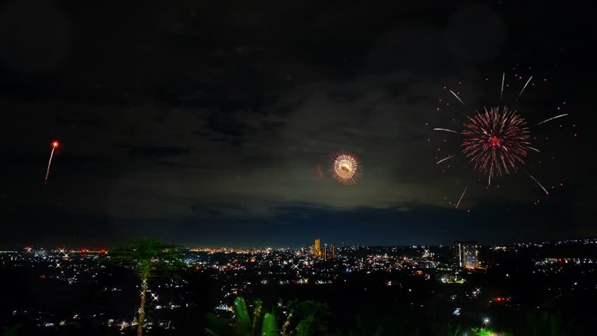New Year Celebration Fireworks Over Suburban Cityscape