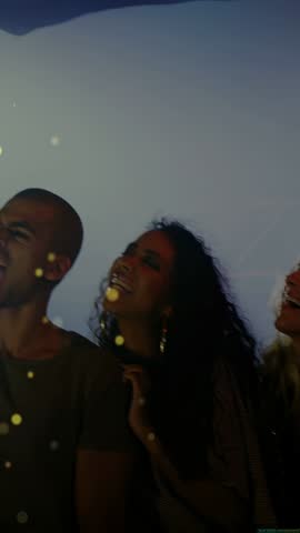 Bearded man entering grabbing mic and leading band singing with bokeh overlay in front. Ensemble, vocals, stage, bokeh, backdrop, lighting, vertical video