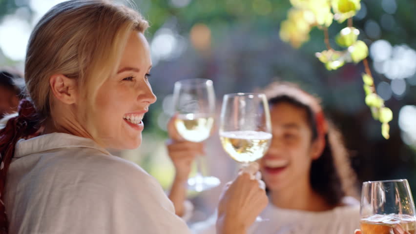 Celebration, cheers or people outdoor with wine, good time or bonding together at reunion event. Dancing, happy or friends in restaurant with toast, birthday party or having fun at social gathering.