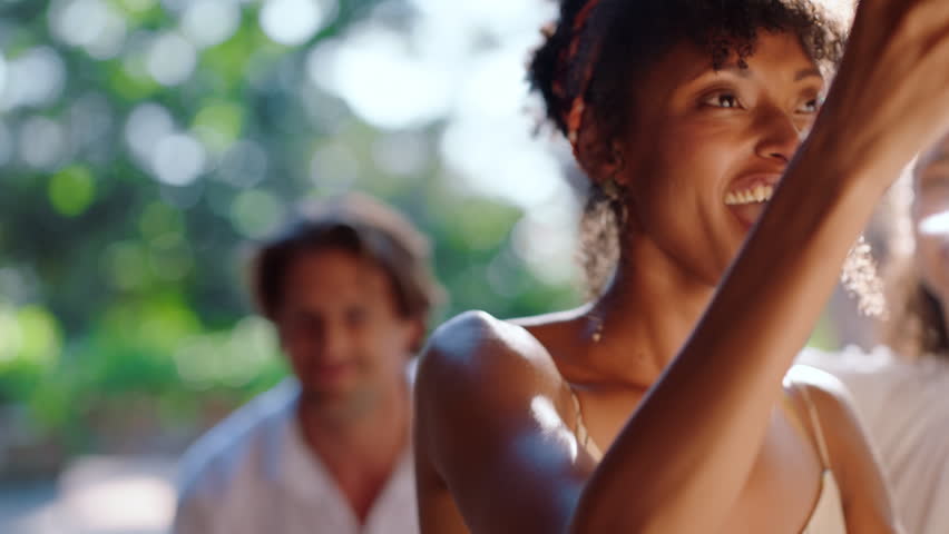 Cheers, friends or woman outdoor with wine, dancing or bonding together at reunion celebration. Happiness, good time or people with drink toast, birthday party or having fun at social gathering.