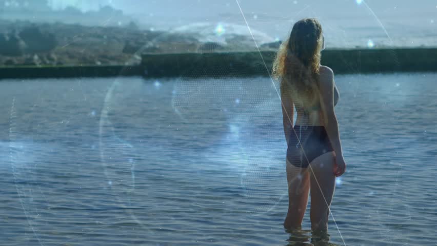 Translucent overlay drifting, woman shifting and stepping right, rippling water, observing horizon. Bikini, beach, sea, shoreline, coast, outdoor, serene