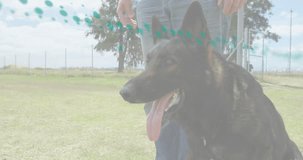 Trainer presenting bite sleeve, Shepherd leaping and gripping for K9 training, green dots tracking. Canine, protection, handler, armguard, outdoor, field, motion - Powered by Shutterstock - Get 15% off with code: PIKWIZARD15