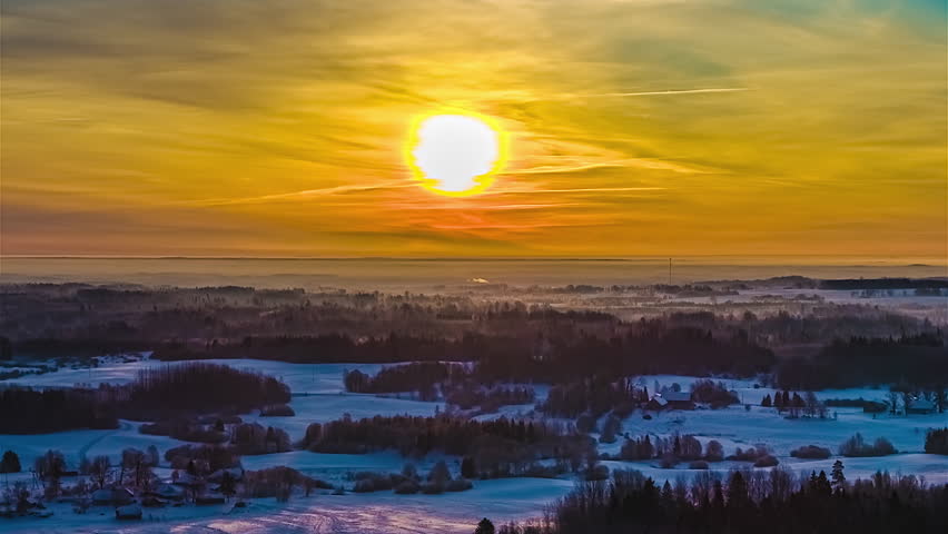 Sunrise time lapse over winter snowy landscape rural countryside time passing hyperlapse