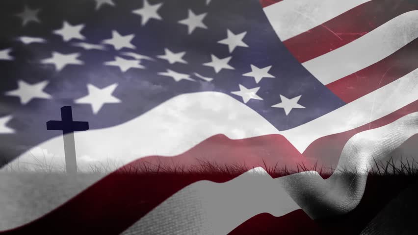 Gusts pushing American flag rippling, reshaping stars and stripes, revealing cross evoking memorial. Ensign, wind, motion, canton, field, outdoor, dramatic