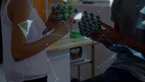 Two students bringing molecules together in science class, causing holographic globe aligning. Collaboration, classroom, augmented, reality, overlay, discovery, exploration - Powered by Shutterstock - Get 15% off with code: PIKWIZARD15