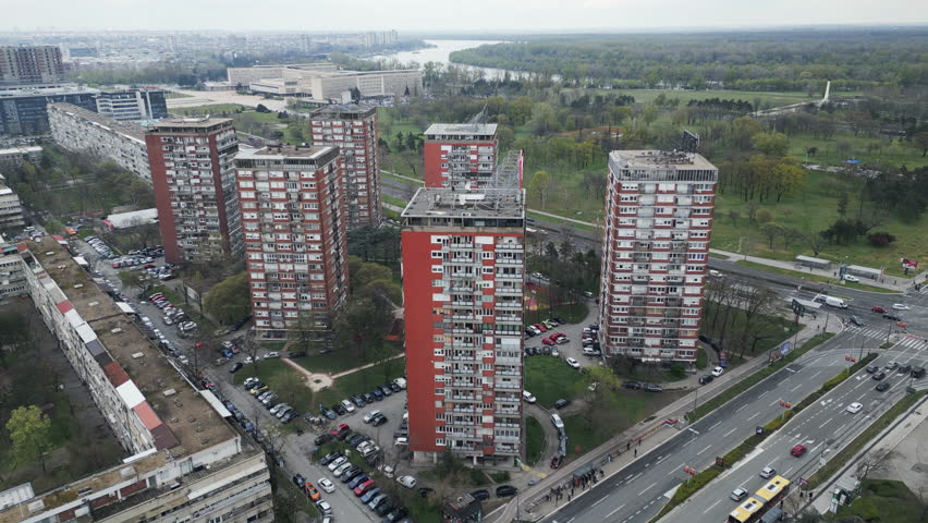 Forward drone flight toward socialist modernism architecture and residential blocks in New Belgrade, Serbia.