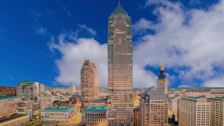 High Angle View of the Cleveland Ohio Skyline Featuring Key Tower and Terminal Tower under a Cloudy Blue Sky Modern Urban Cityscape and Financial District Architecture in the United States Travel and Business Concept Photography
