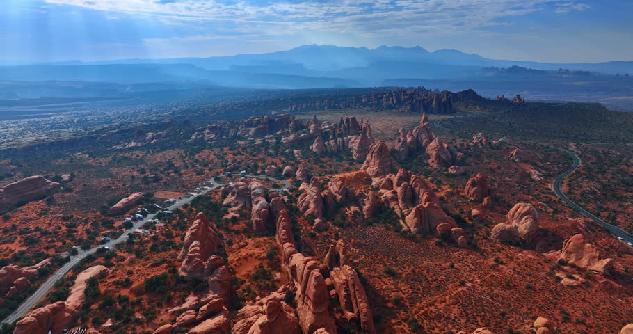 Scenic view on the amazing deserted landscape with rounded rocks. Drone footage above the Arches National Park, Utah, USA.