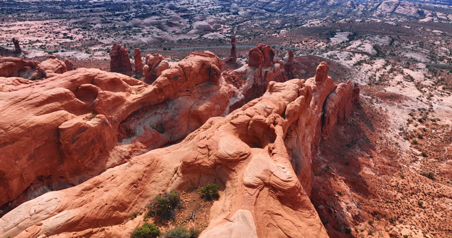 Impressive red canyons created by the power of wind. Drone flight over the Arches National Park, Utah, USA.