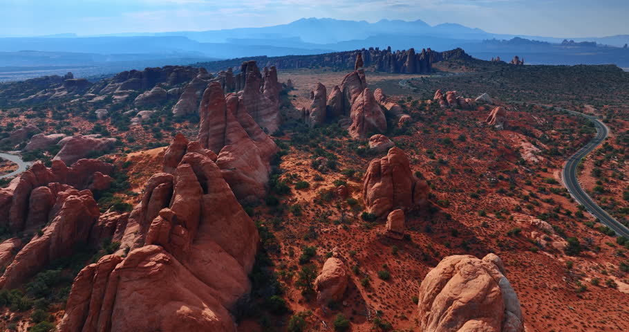 Flight over the desert with amazing canyons. Stunning scenery of the Arches National Park, Utah, USA from drone.