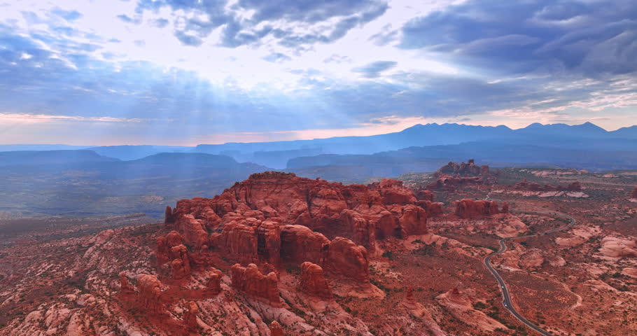 Overcast sky above the panorama of the stunning Arches National Park, Utah, USA. Deserted landscape with canyons from aerial view.