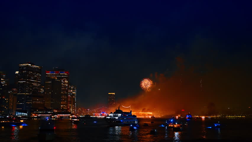 Fantastic firework in the dark sky over the East River. Beautiful celebration in New York at night.