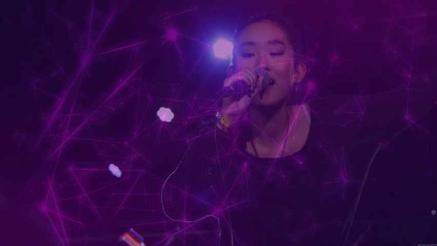 Singer starting music leaning mic engaging audience reaching hands, purple web across singer hands. Vocalist, performer, stage, lights, projection, concert, live
