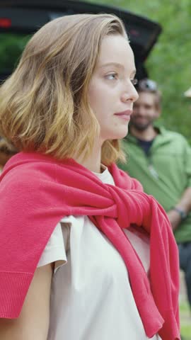 A Young Woman Enjoying the Beauty of Nature While Dressed in Casual Attire and a Cozy Sweater