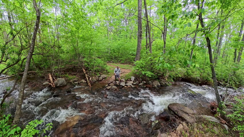 Man Crossing Creek and Putting Away Pole in Shenandoah National Park