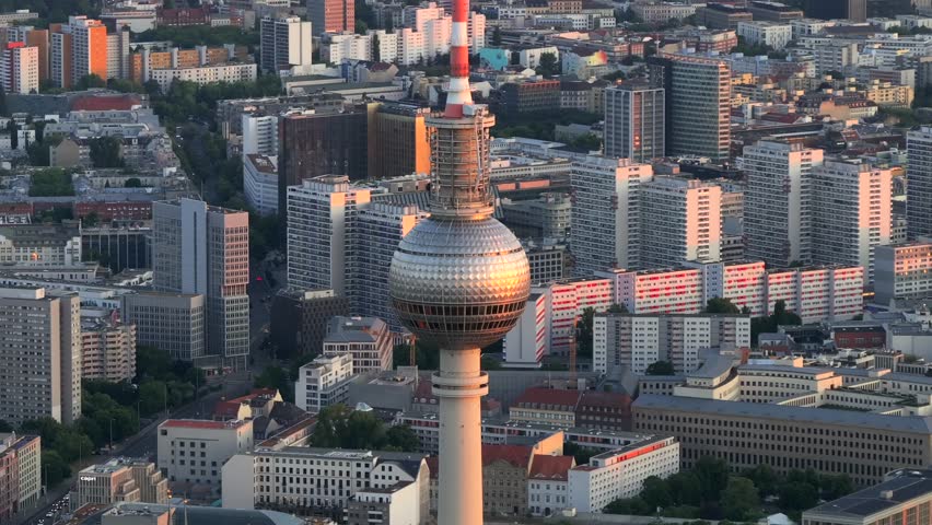 Berlin TV Tower Close up Aerial View with Amazing Soft Sunset Light. Alexanderplatz Fernsehturm in Berlin City Center.