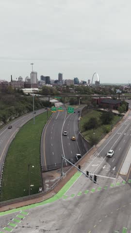 Cityscape view of Saint Louis, MO, with skyscraper buildings and the highway durying a beautiful spring day.
