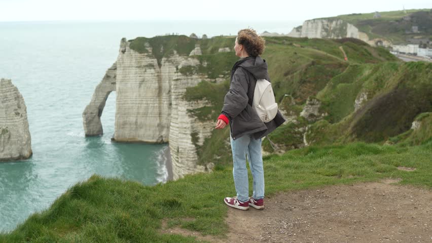 Views from Etreta cliffs in France with a person standing on the edge
