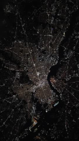 Vertical rotating over Philadelphia city at night with urban lights satellite view from space based on Nasa imagery
