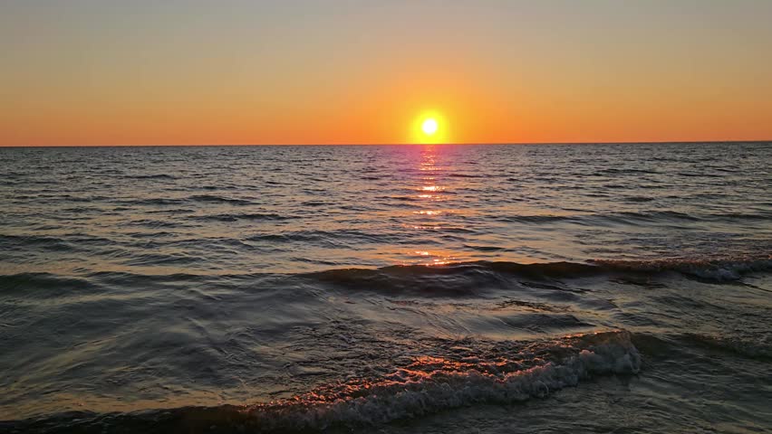 Sunset Over Ocean With Waves