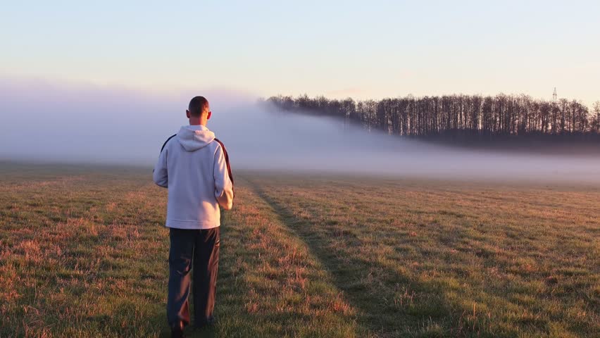 Middle age man taking photo with his smartphone. Lifestyle, slow motion