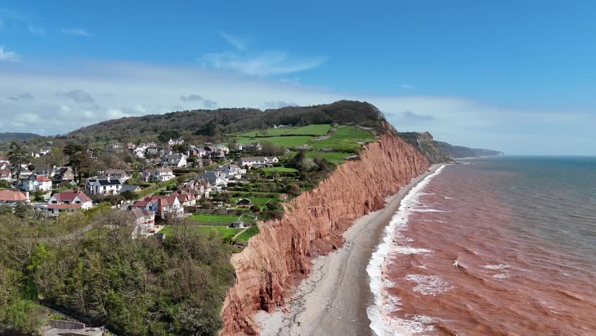 Cliff edge houses on red cliffs Sidmouth Devon aerial