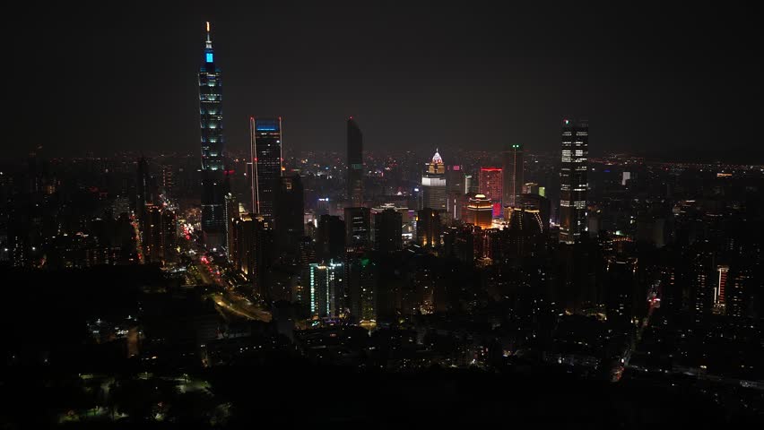 Taipei city skyline at night featuring the taipei 101 skyscraper