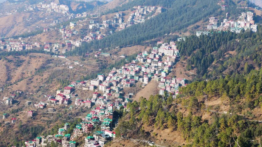 dense hillside town with colorful buildings on mountain slope