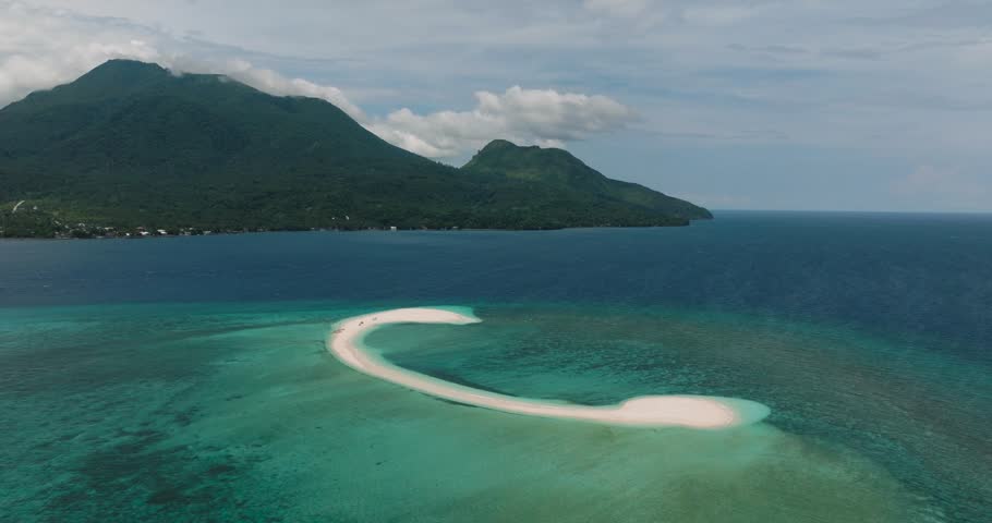 Drone view of White Island in Camiguin and turquoise water and corals. Philippines. Travel destination.