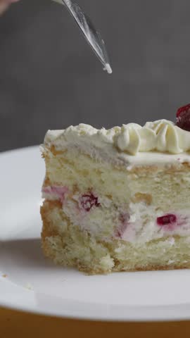 Close-up of Spoon Scooping Fruit Cream Cake
