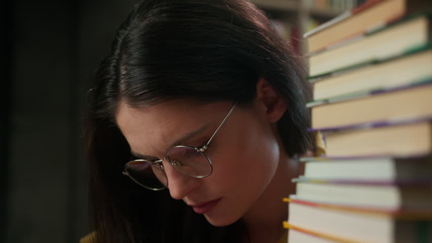 Exhausted tired Caucasian female student suffering headache studying indoor library young woman learner migraine pain stressed girl education overload university study fatigue pressure health problem