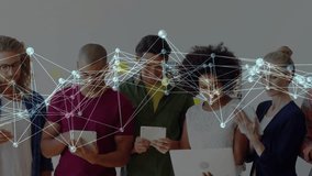 Tech team collaborating, moving network mesh sweeping, showing screens, steadying, tapping, swiping. Office, colleagues, tablets, laptop, devices, overlay, nodes - Powered by Shutterstock - Get 15% off with code: PIKWIZARD15