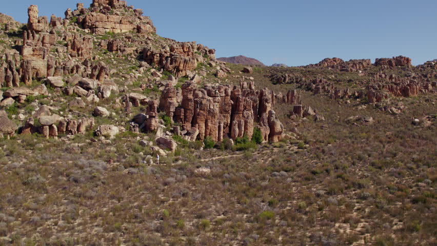 Slow Motion Aerial Drone Shot of Cederberg Wilderness at Sunset, Rugged Sandstone Mountains in South Africa Landscape