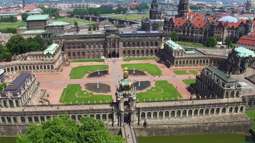 Aerial view of the Dresden Zwinger courtyard. Symmetrical gardens, fountains, and pathways characterize this Baroque masterpiece seen from above.