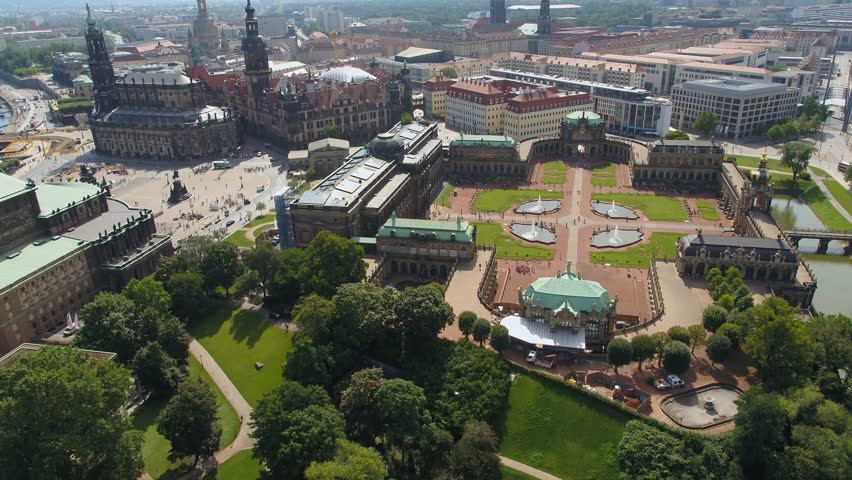 Aerial view of the Dresden Zwinger courtyard. Symmetrical gardens, fountains, and pathways characterize this Baroque masterpiece seen from above.