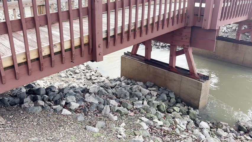 Pedestrian bridge over Clear Fork Creek in Pioneer, Ohio with gimbal video panning left to right.