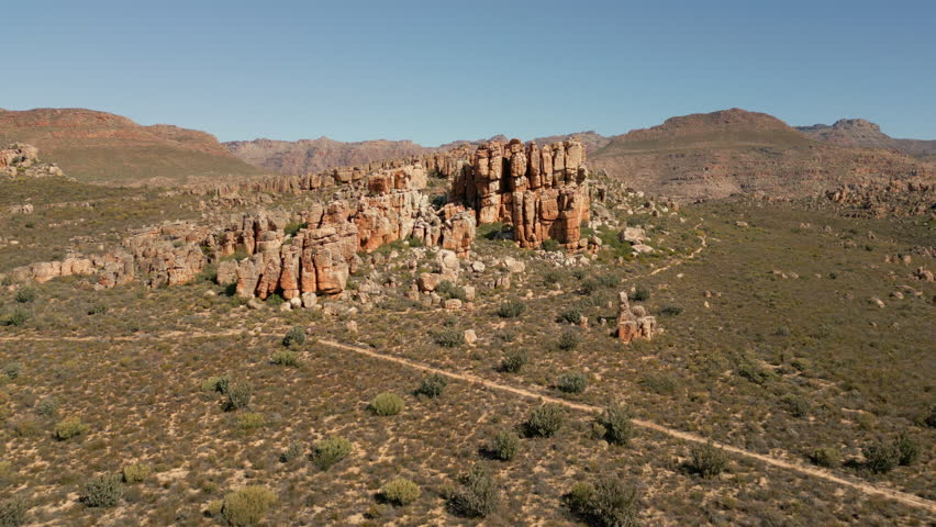 Slow Motion Aerial Drone Shot of Cederberg Wilderness at Sunset, Rugged Sandstone Mountains in South Africa Landscape