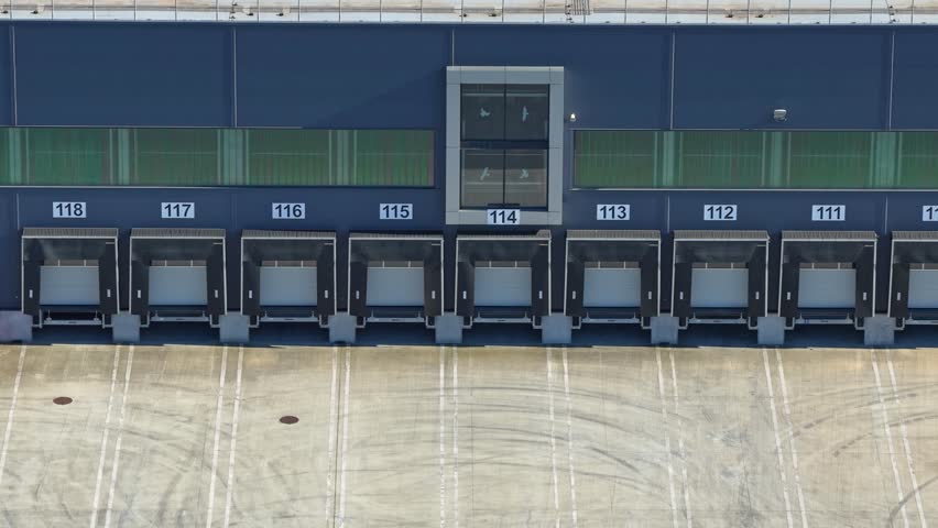 Aerial drone view to a loading and unloading area of transport logistics center on the Trakia motorway near to Sliven, Bulgaria