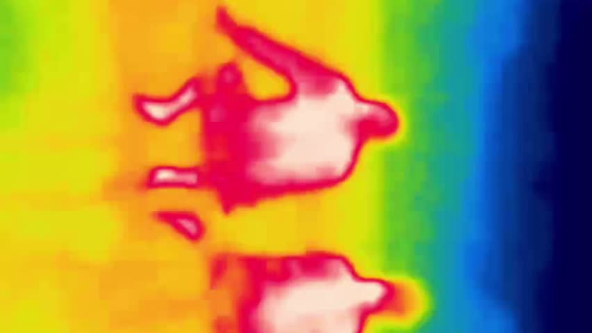 People resting on the side of the road. Low infrared waves.. Image from thermal imager device. Vertical Video