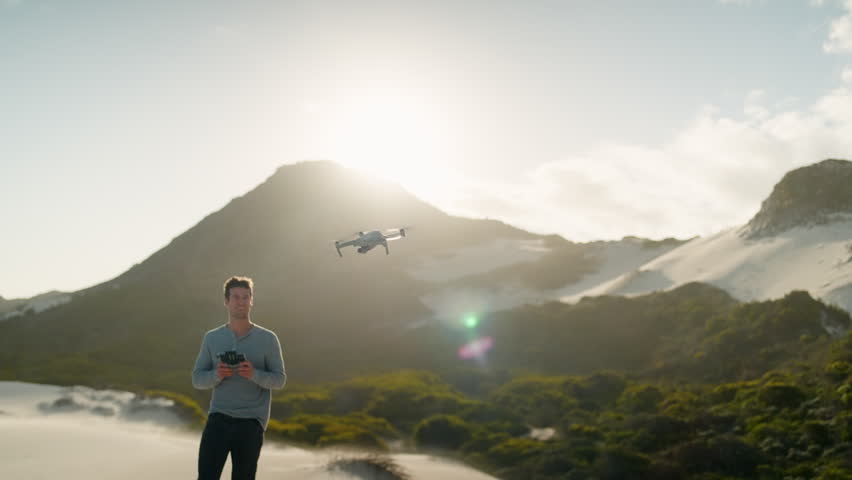 Slow Motion Man Taking Off and Flying Drone on Betty
