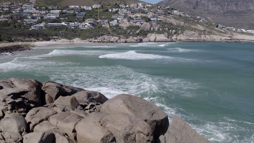 Slow Motion Aerial Drone Shot of Crashing Waves at Llandudno Beach, Turquoise Atlantic Surf in Cape Town South Africa