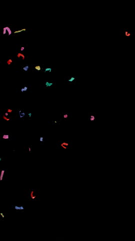 Super slow motion of flying confetti isolated on black background. Filmed on high speed cinema camera