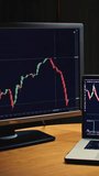 Trader home office. Monitor and laptop are on the table. Trading program or an exchange. Charts and graphs for the crypto market., analyzing stock quotes on tablet - Powered by Shutterstock - Get 15% off with code: PIKWIZARD15