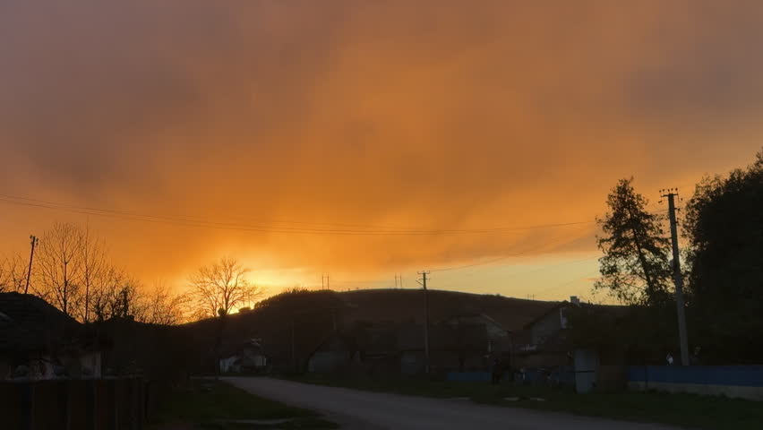Golden hour sunset over rural countryside village