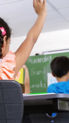 Children raising hands in classroom with school supplies animation in foreground. Education, learning, students, participation, engagement, teaching