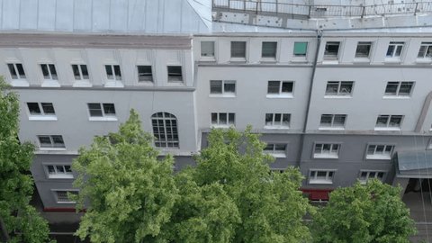 Drone Flying Sideways along Residential Building Facade